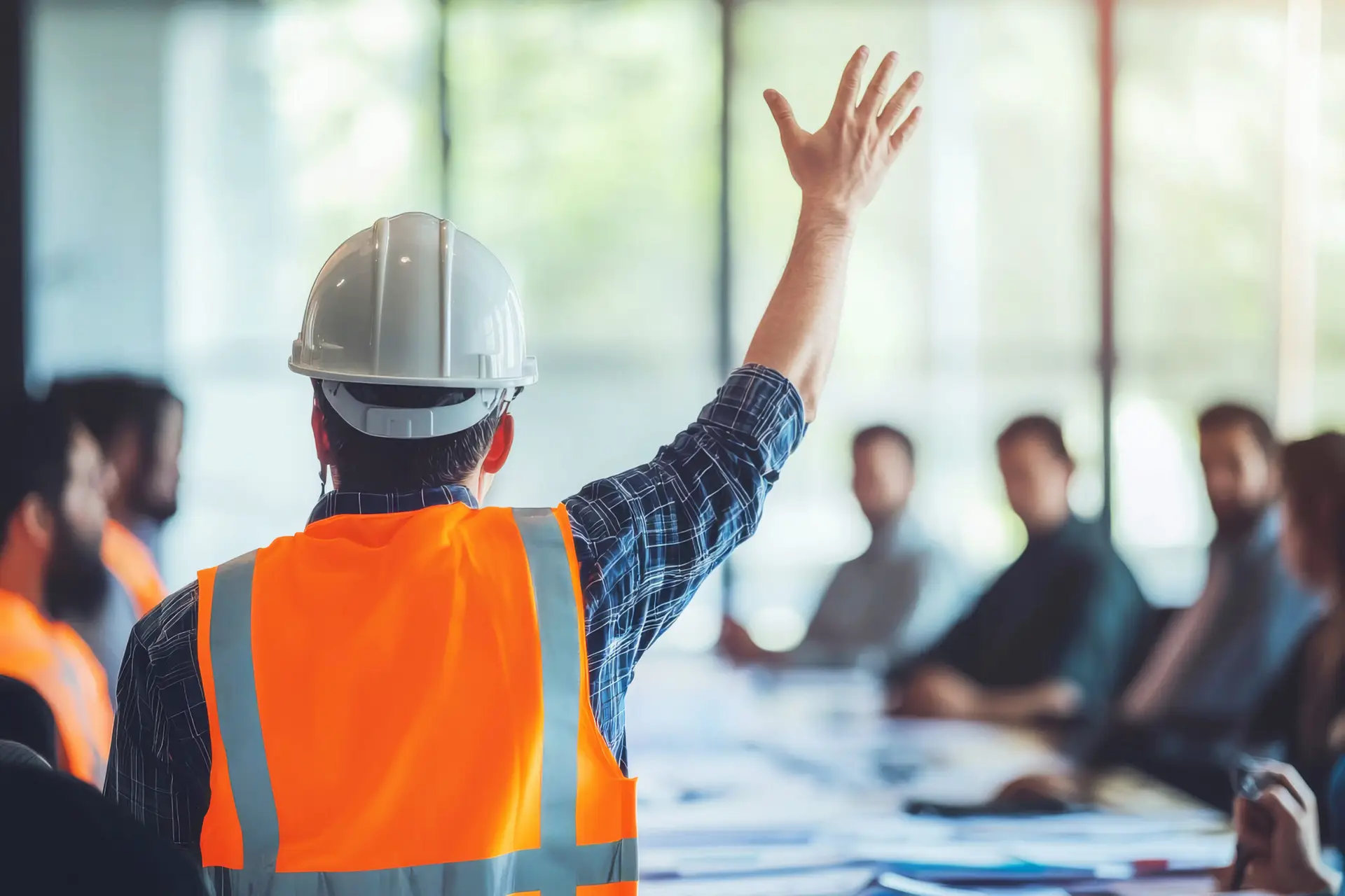A highly detailed, photorealistic image of a construction worker wearing a helmet and a reflective vest, confidently raising his hand during a meeting. The setting is a large, modern conference room with other engineers and industry professionals seated around a table, looking at him attentively. Blueprints and safety documents are spread across the table. The lighting is bright and professional, emphasizing engagement and leadership. --chaos 15 --ar 3:2 --quality 2 --raw --stylize 50 --v 6.1 Job ID: 007b4126-4cd0-4146-9dc6-d0dd2dc629b6