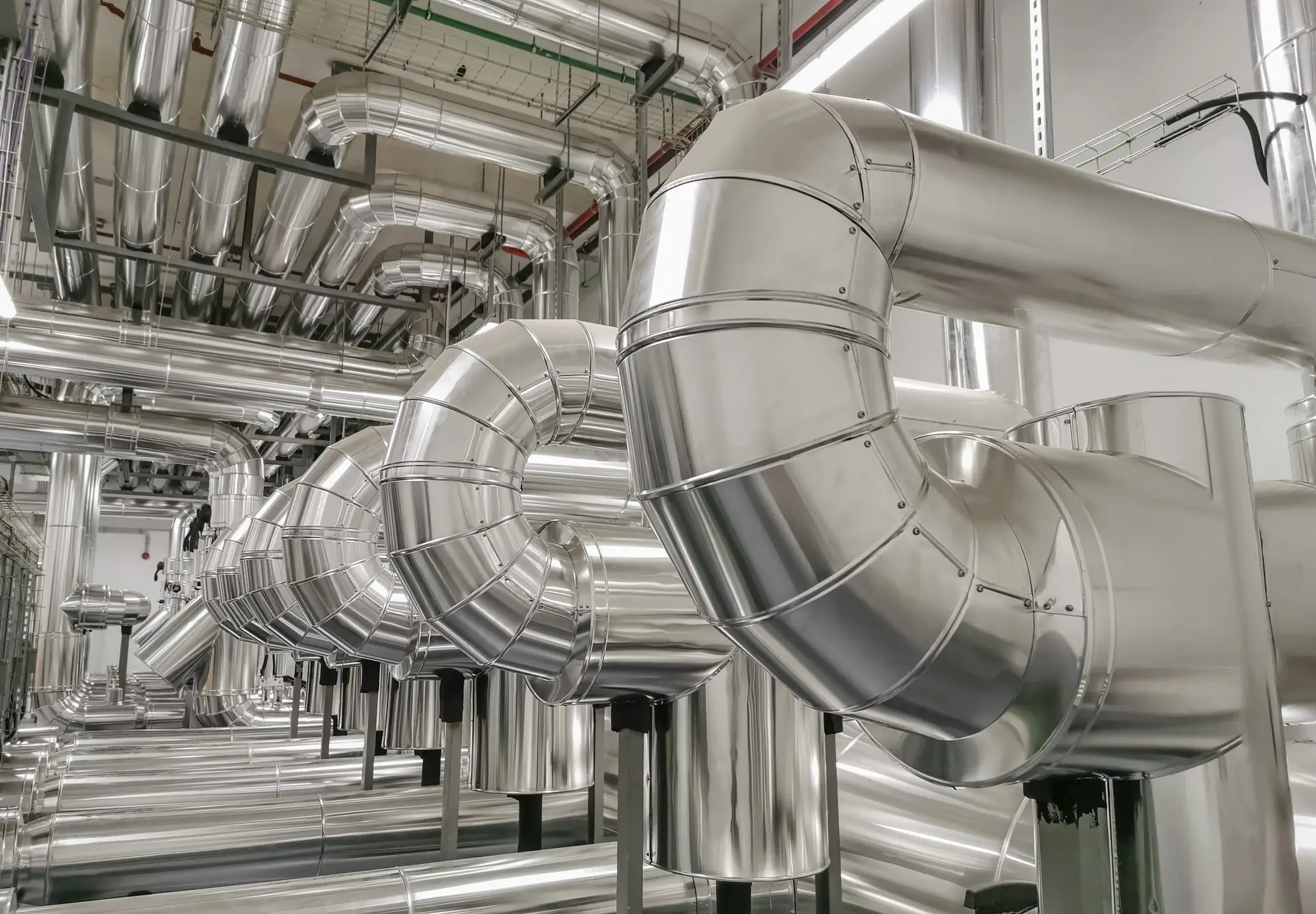 Industrial system with stainless steel ducts, forced ventilation of buildings and industrial equipment, large metallic ducts for air inlet and outlet, air renewal, industrial HVAC system...